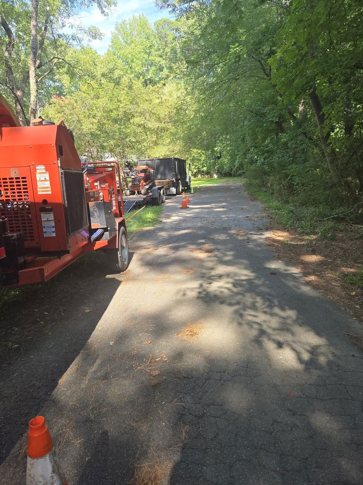 Wood chipper and trucks staged on a Marietta GA street, July 2025