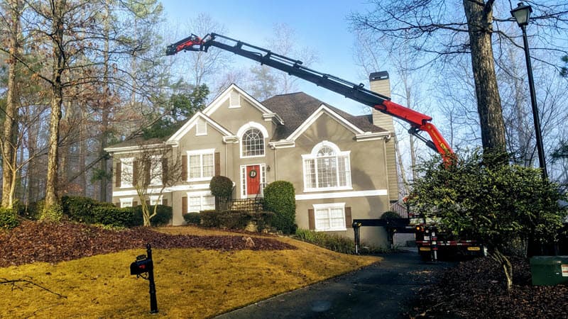 Fallen tree blocking driveway in Atlanta being removed by professionals