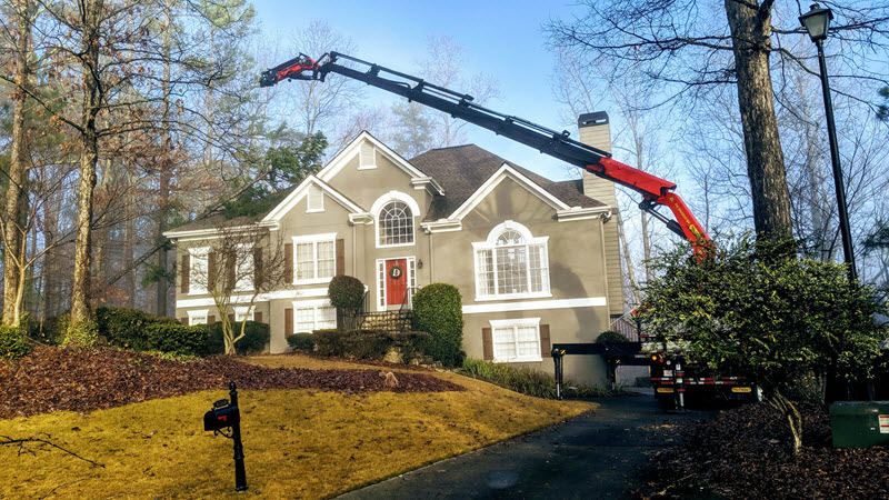 Fallen tree blocking driveway in Atlanta being removed by professionals