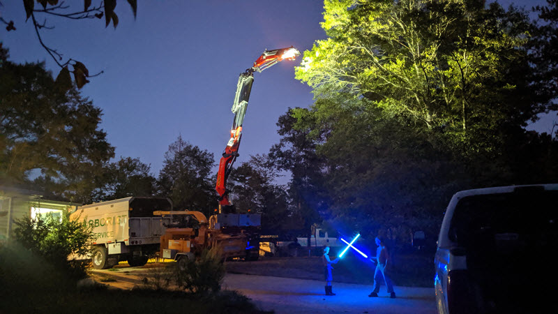 Tree Machine crew using crane for emergency tree removal in Atlanta
